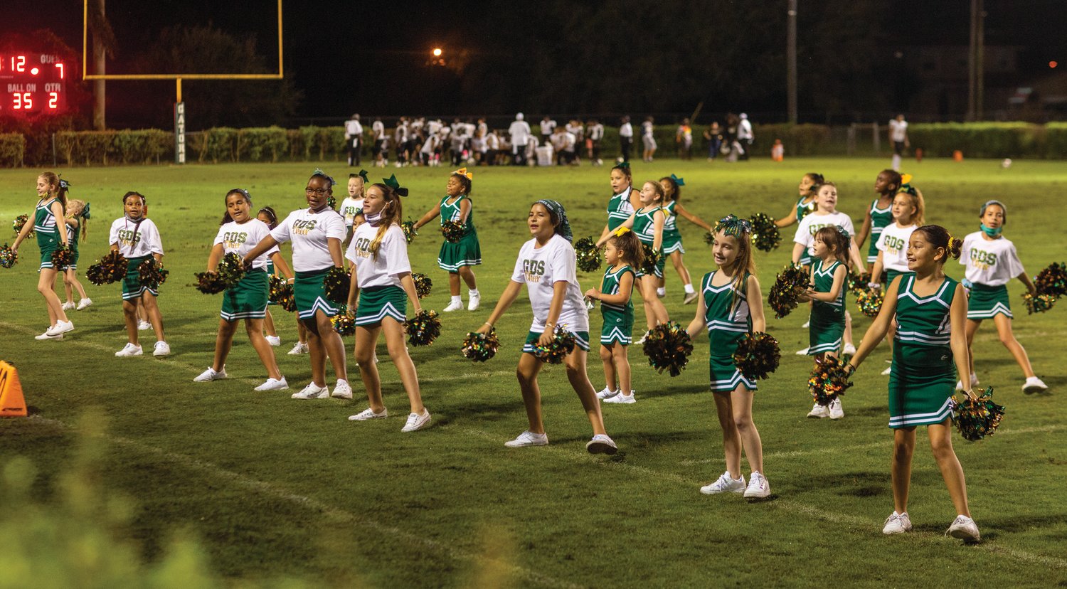 The Glades Day cheering squad keeps spirits high during halftime at the Oct. 23 game against Moore Haven.